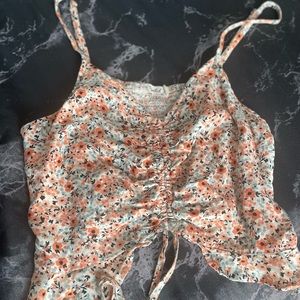 XL floral crop top with adjustable straps and tie.
